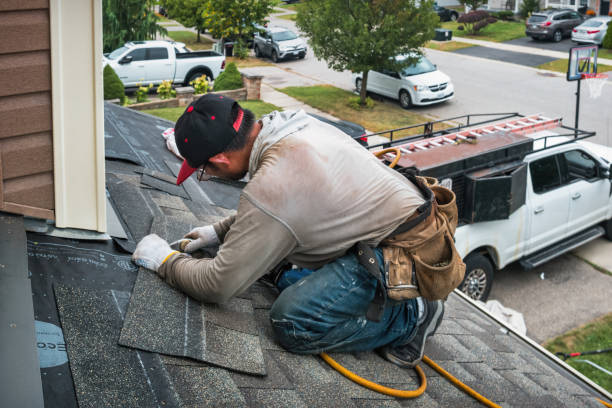 Professional Roofing technician working in Newark, NY